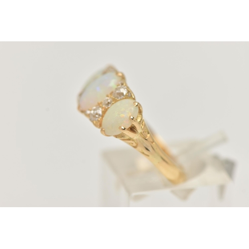 49 - AN EARLY 20TH CENTURY OPAL AND DIAMOND RING, set with graduating oval opal cabochons, measuring from... 