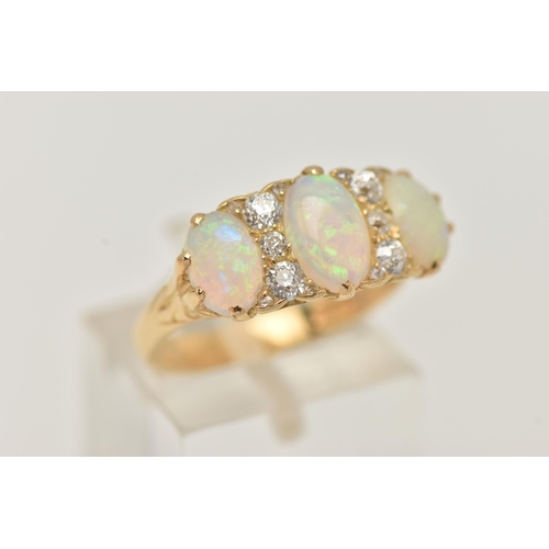 49 - AN EARLY 20TH CENTURY OPAL AND DIAMOND RING, set with graduating oval opal cabochons, measuring from... 