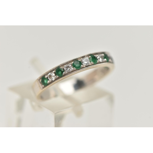 5 - A WHITE METAL EMERALD AND DIAMOND HALF ETERNITY RING, set with seven circular cut emeralds, interspa... 