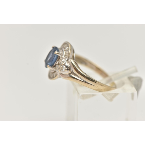 51 - A WHITE METAL SAPPHIRE AND DIAMOND RING, set with an oval cut sapphire, measuring approximately 7.05... 