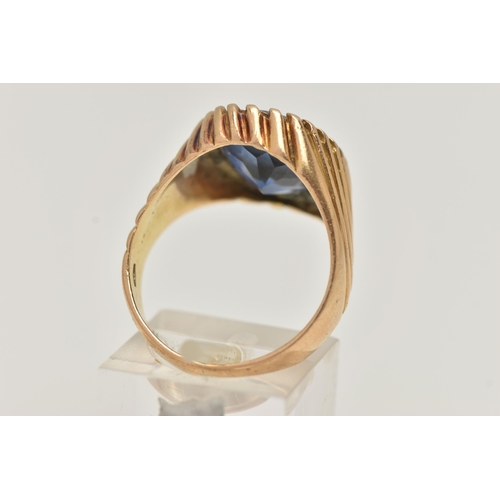 67 - A GEM SET SIGNET RING, designed with an oval sapphire in a tapered ring mount with banded detail, st... 