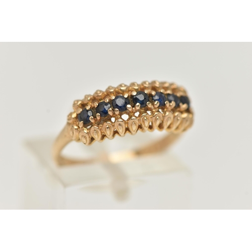 7 - A 9CT GOLD SAPPHIRE RING, seven circular cut sapphires prong set in yellow gold, hallmarked 9ct Lond... 