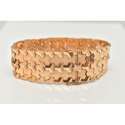 80 - A WIDE ITALIAN BRACELET, designed as articulated geometric links to the push piece clasp with figure... 