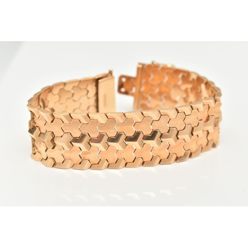 80 - A WIDE ITALIAN BRACELET, designed as articulated geometric links to the push piece clasp with figure... 