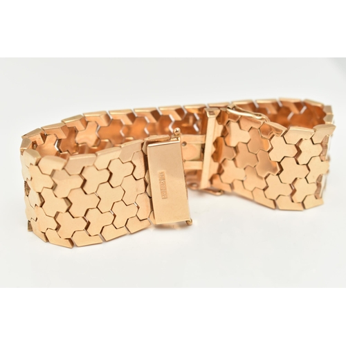 80 - A WIDE ITALIAN BRACELET, designed as articulated geometric links to the push piece clasp with figure... 