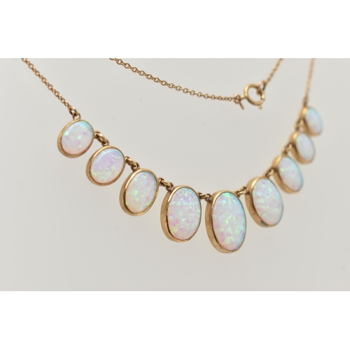 87 - A YELLOW METAL SYNTHETIC OPAL PENDANT NECKLACE, designed as a series of nine graduated synthetic opa... 