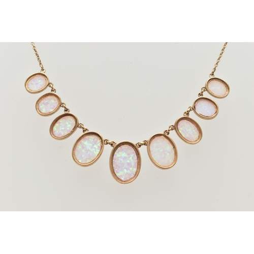 87 - A YELLOW METAL SYNTHETIC OPAL PENDANT NECKLACE, designed as a series of nine graduated synthetic opa... 