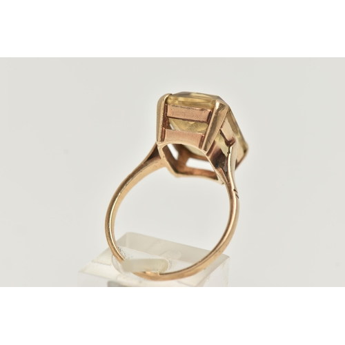 113 - A 9CT GOLD GEM SET RING, a rectangular cut citrine prong set in rose gold, approximate stone length ... 