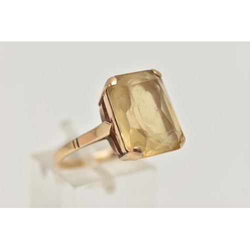 113 - A 9CT GOLD GEM SET RING, a rectangular cut citrine prong set in rose gold, approximate stone length ... 