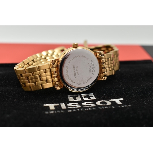 119 - A LADIES 'TISSOT' WRISTWATCH, quartz movement, gold tone round dial, signed 'Tissot 1853', baton mar... 