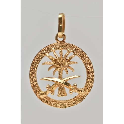 121 - A YELLOW METAL PENDANT, of a circular open work form, depicting a palm tree and two swords, with a t... 