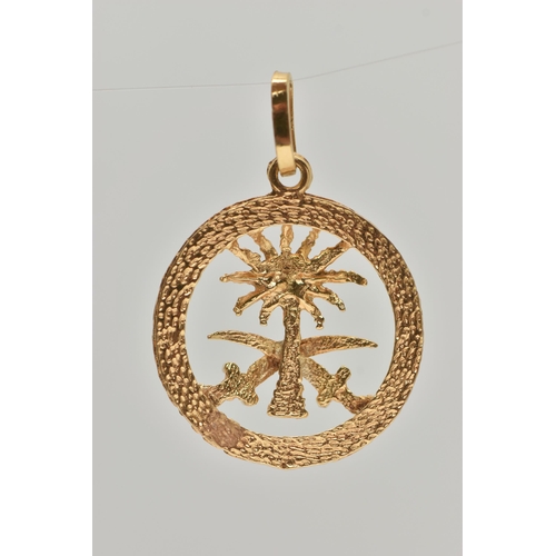 121 - A YELLOW METAL PENDANT, of a circular open work form, depicting a palm tree and two swords, with a t... 