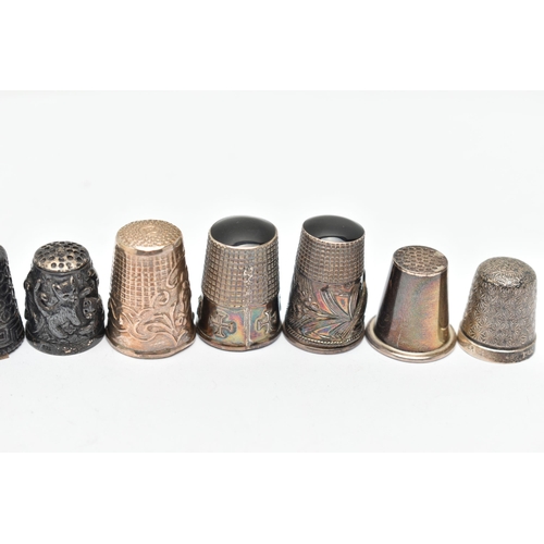 141 - A BAG OF WHITE METAL THIMBLES, various designs and patterns, some set with semi-precious stone termi... 