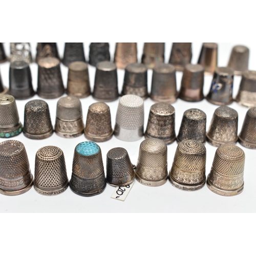 141 - A BAG OF WHITE METAL THIMBLES, various designs and patterns, some set with semi-precious stone termi... 