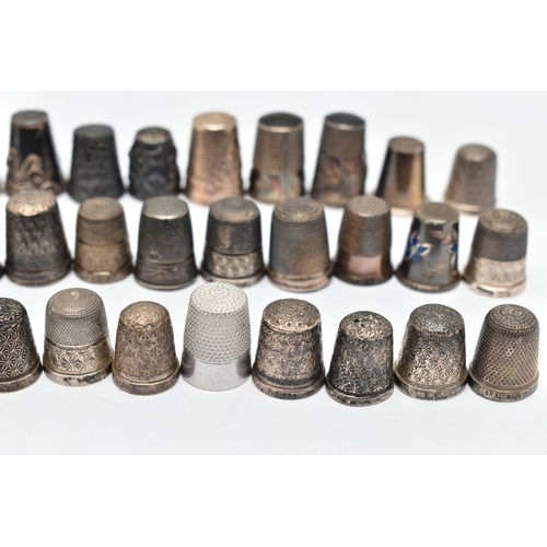 141 - A BAG OF WHITE METAL THIMBLES, various designs and patterns, some set with semi-precious stone termi... 