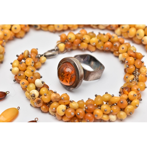 173 - AN ASSORTMENT OF AMBER JEWELLERY, to include a large statement necklace, comprised of thirty nine am... 