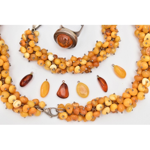 173 - AN ASSORTMENT OF AMBER JEWELLERY, to include a large statement necklace, comprised of thirty nine am... 