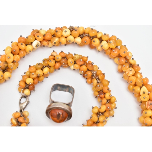 173 - AN ASSORTMENT OF AMBER JEWELLERY, to include a large statement necklace, comprised of thirty nine am... 