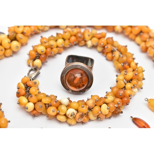 173 - AN ASSORTMENT OF AMBER JEWELLERY, to include a large statement necklace, comprised of thirty nine am... 