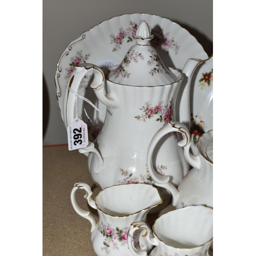 392 - A ROYAL ALBERT 'LAVENDER ROSE' PATTERN TEA SET, comprising a coffee pot, teapot, cake plate, two mil... 