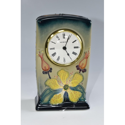 437 - A MOORCROFT POTTERY 'HYPERICUM' PATTERN MANTEL CLOCK, tube lined with yellow and coral pink flowers ... 