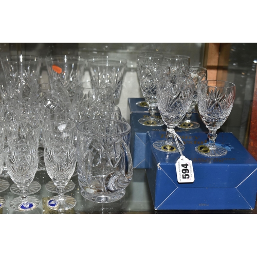 A LARGE QUANTITY OF ASSORTED CUT CRYSTAL DRINKING GLASSES, comprising