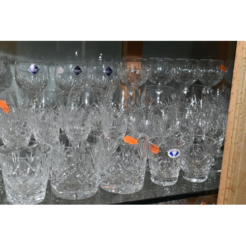 A LARGE QUANTITY OF ASSORTED CUT CRYSTAL DRINKING GLASSES, comprising