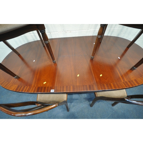 1202 - WILLIAM LAWRENCE, A LATE 20TH CENTURY MAHOGANY OVAL EXTENDING DINING TABLE, with a single fold out l... 