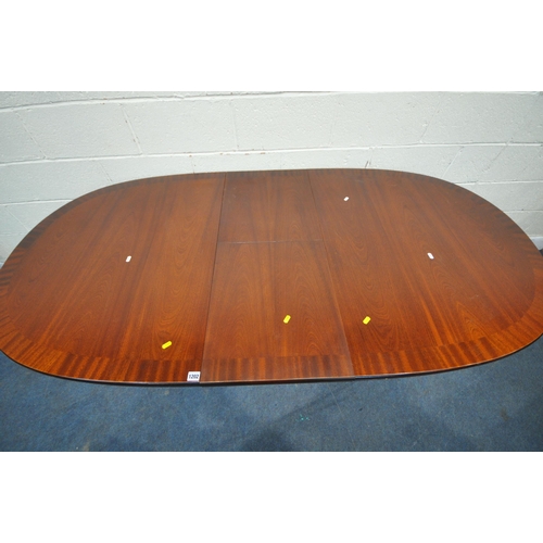 1202 - WILLIAM LAWRENCE, A LATE 20TH CENTURY MAHOGANY OVAL EXTENDING DINING TABLE, with a single fold out l... 