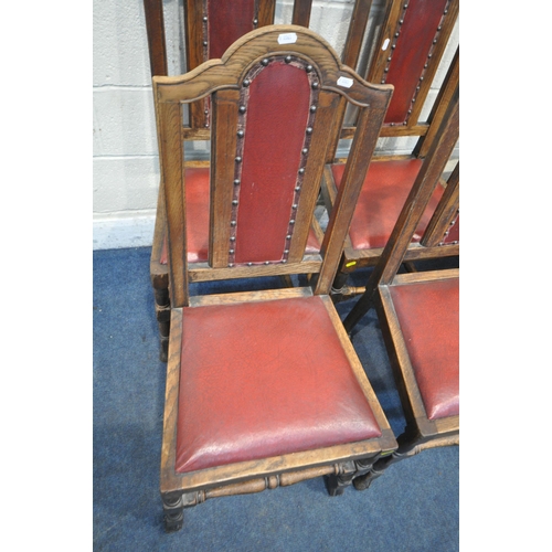 1203 - A SET OF FOUR 20TH CENTURY OAK DINING CHAIRS, with an arched crest, oxblood leatherette upholstery, ... 