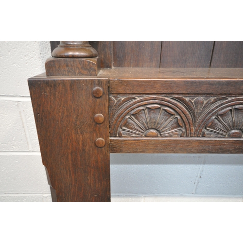 1208 - A LARGE EARLY 20TH CENTURY OAK FIRE SURROUND, with scrolled and foliate carvings, bulbous turned sup... 