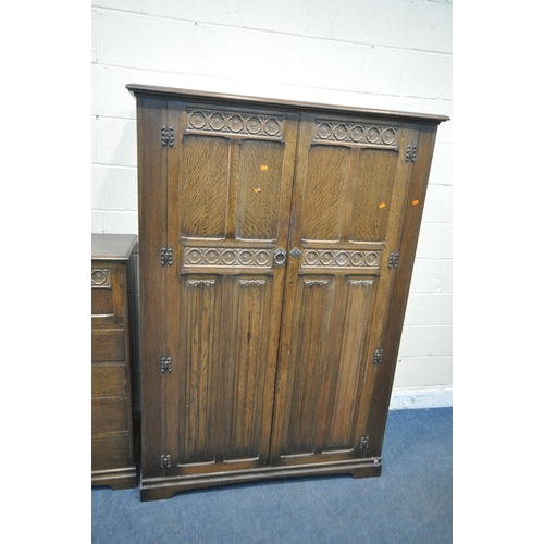 1220 - A 20TH CENTURY OAK TWO PIECE BEDROOM SUITE, comprising a double door wardrobe, with floral and linen... 