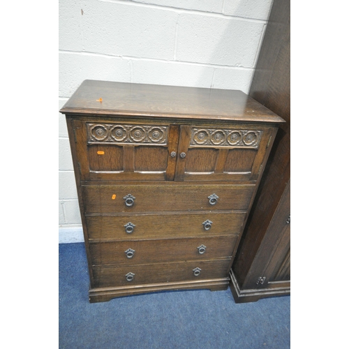 1220 - A 20TH CENTURY OAK TWO PIECE BEDROOM SUITE, comprising a double door wardrobe, with floral and linen... 