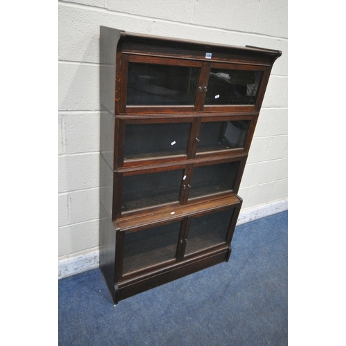 1226 - W M BAKER AND CO, OXFORD, AN EARLY 20TH CENTURY OAK SECTIONAL BOOKCASE, with one deep bottom section... 