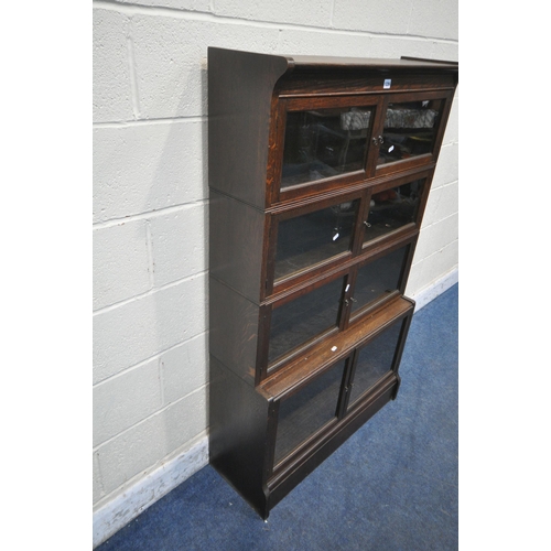 1226 - W M BAKER AND CO, OXFORD, AN EARLY 20TH CENTURY OAK SECTIONAL BOOKCASE, with one deep bottom section... 