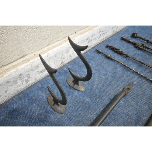 1230 - A PAIR OF VICTORIAN CAST IRON ANTI CLIMB SPIKES, a door handle, a chain pipe wrench, along with four... 