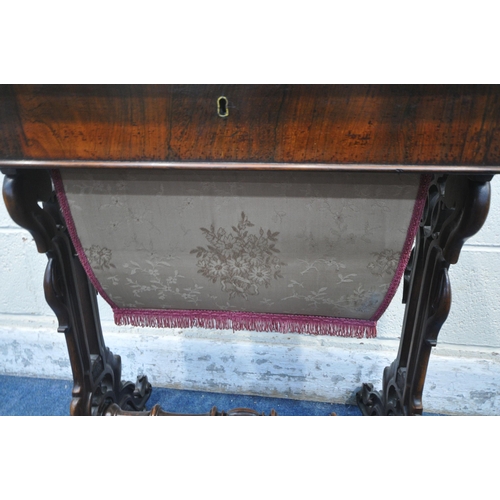 1238 - A VICTORIAN ROSEWOOD WORK TABLE, with a hinged lid, that's enclosing various divisions, raised on sc... 