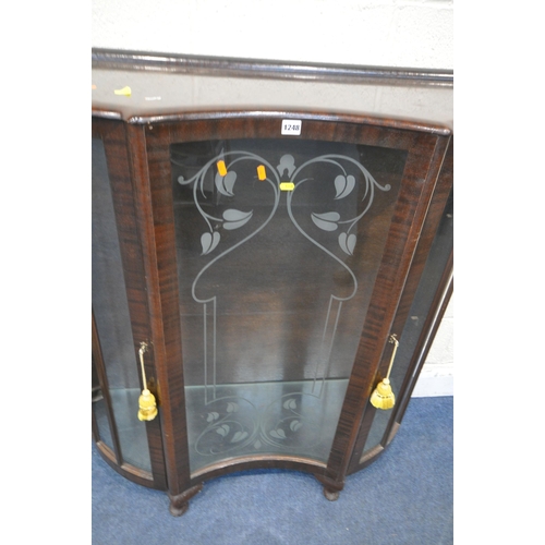 1248 - TWO 20TH CENTURY MAHOGANY DISPLAY CABINETS, each with a single door and two glass shelves, on cabrio... 