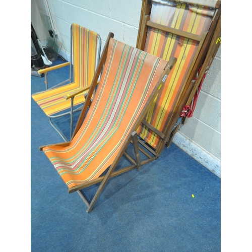 1249 - FOUR MID CENTURY FOLDING BEACH CHAIRS, with stripped fabric seats, along with a set of four folding ... 