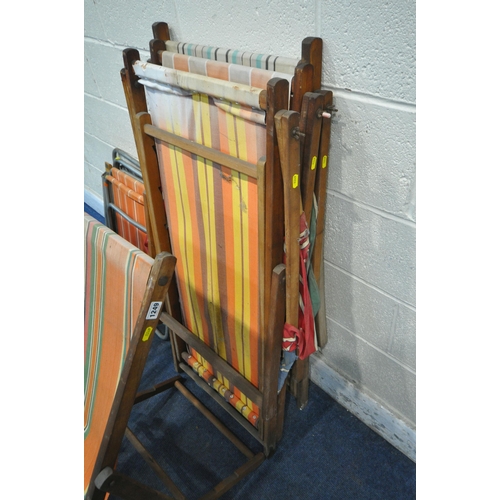 1249 - FOUR MID CENTURY FOLDING BEACH CHAIRS, with stripped fabric seats, along with a set of four folding ... 