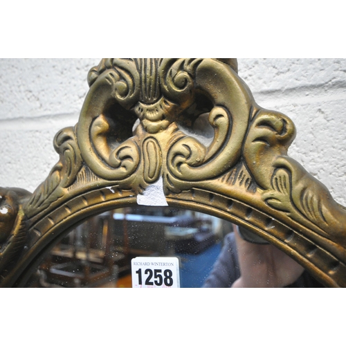 1258 - TWO GILT RESIN WALL MIRRORS, with cherub and foliate details, larger mirror 64cm x 48cm, a rectangul... 