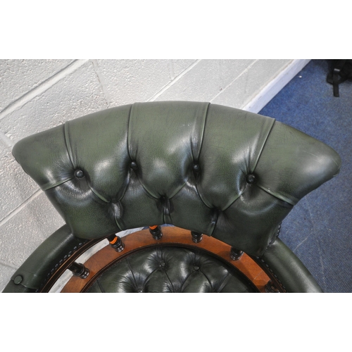 1273 - A 2OTH CENTURY MAHOGANY SWIVEL CAPTAINS CHAIR, with buttoned green leather upholstery, raised on fiv... 