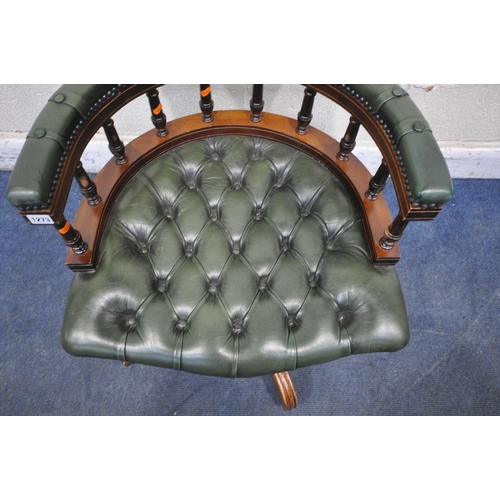 1273 - A 2OTH CENTURY MAHOGANY SWIVEL CAPTAINS CHAIR, with buttoned green leather upholstery, raised on fiv... 