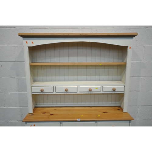 1287 - A MODERN PARTIALLY PAINTED PINE DRESSER, the top two tier plate rack and four drawers, atop a base w... 