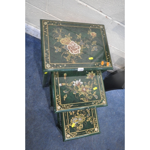 1289 - A GREEN LACQUERED NEST OF THREE TABLES, with floral patterns, smallest table with a single drawer, l... 