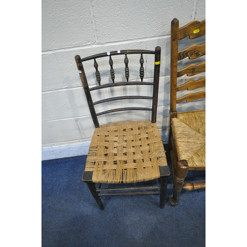 1297 - A SET OF THREE EARLY 20TH CENTURY OAK RUSH SEATED LADDER BACK CHAIRS, including one carver, another ... 