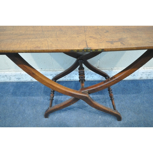 1298 - AN EARLY VICTORIAN MAHOGANY FOLDING CAMPAIGN COACHING TABLE, with a rectangular top, raised on a cro... 