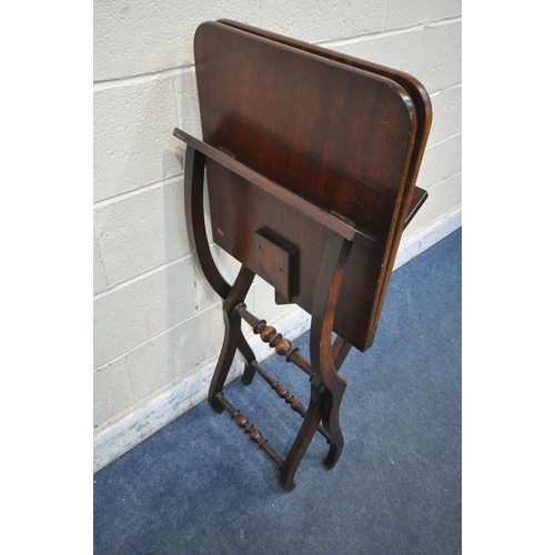 1298 - AN EARLY VICTORIAN MAHOGANY FOLDING CAMPAIGN COACHING TABLE, with a rectangular top, raised on a cro... 