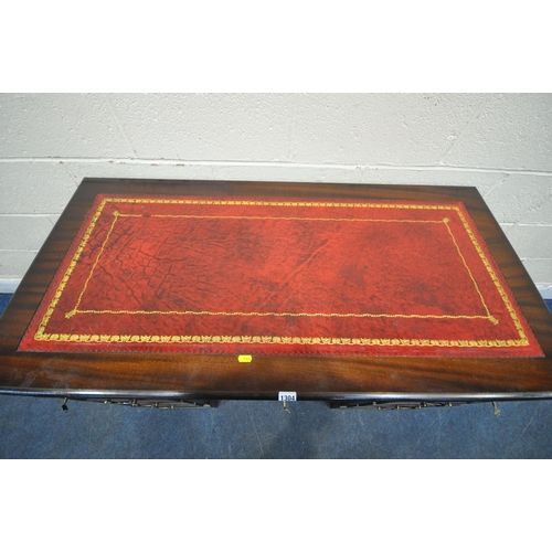 1304 - A 20TH CENTURY MAHOGANY TWIN PEDESTAL DESK, with an oxblood leather writing surface, and an arrangem... 