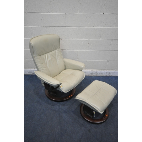 1306 - AN EKORNES STRESSLESS CREAM LEATHER RECLINING ARMCHAIR, with a matching footstool (condition report:... 